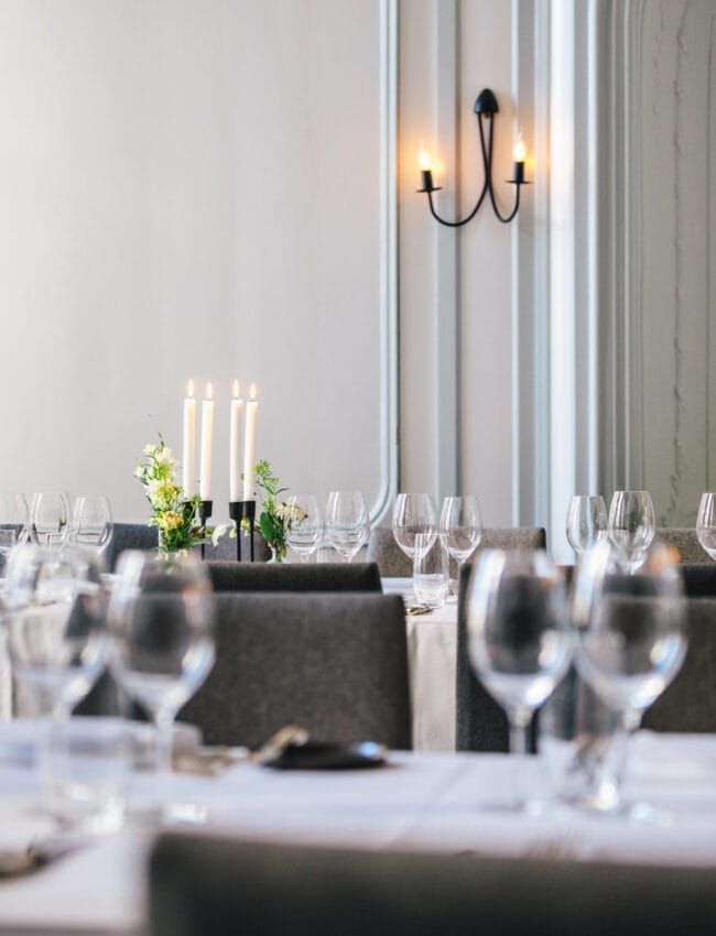 Dinning table set-up for a private dining event in the Regents venue at The Dylan Amsterdam, boutique hotel and part of The Leading Hotels of The World